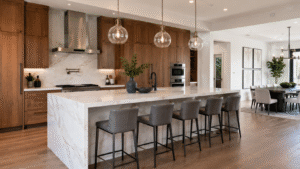 Luxury waterfall kitchen island with seating and quartz countertop.